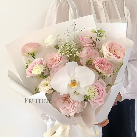 Pink and white roses mixed with white Phalaenopsis bouquet