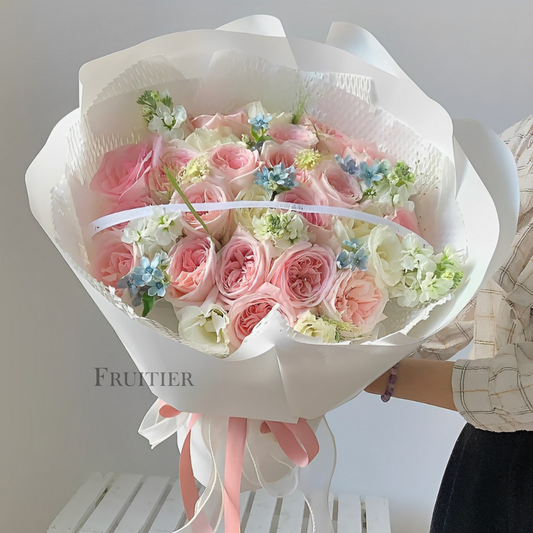 Pink and white roses mixed with violet bouquet