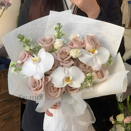 Light purple roses mixed with white phalaenopsis bouquet