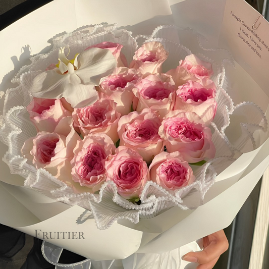 Dark pink roses mixed with white Phalaenopsis bouquet