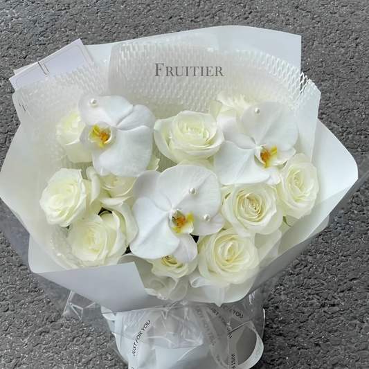 White roses mixed with white Phalaenopsis bouquet