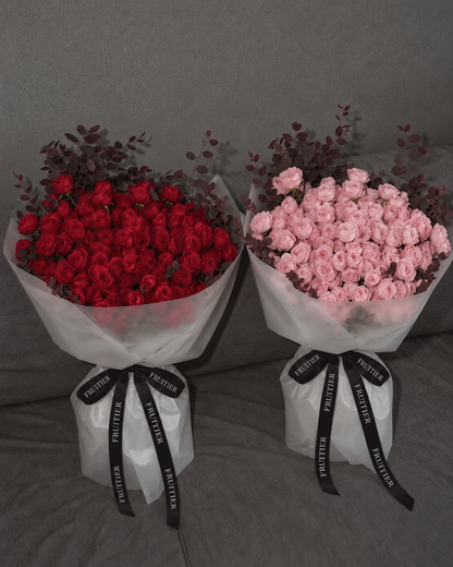 The Veil Collection's translucent frosted wrapping and red and pink roses